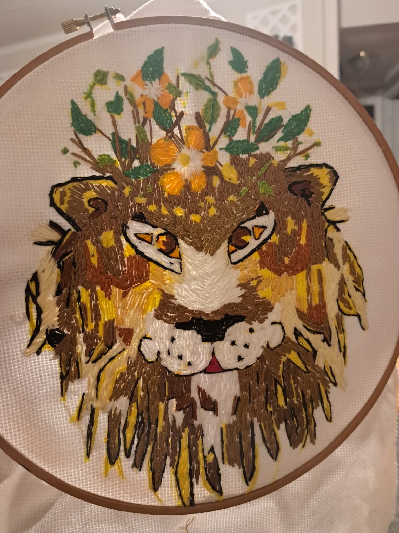 embroidered lion with flower crown