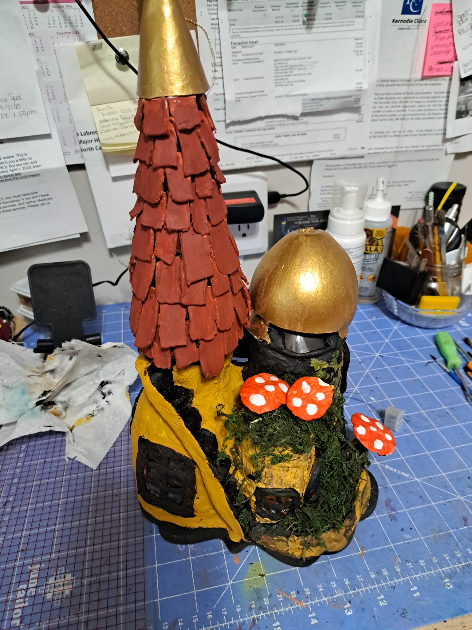 fairy house with red shingled roof